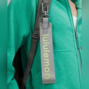 NWT Lululemon Never Lost Keychain in Rhino Grey/Electric Lemon. 1.7” x 12”.